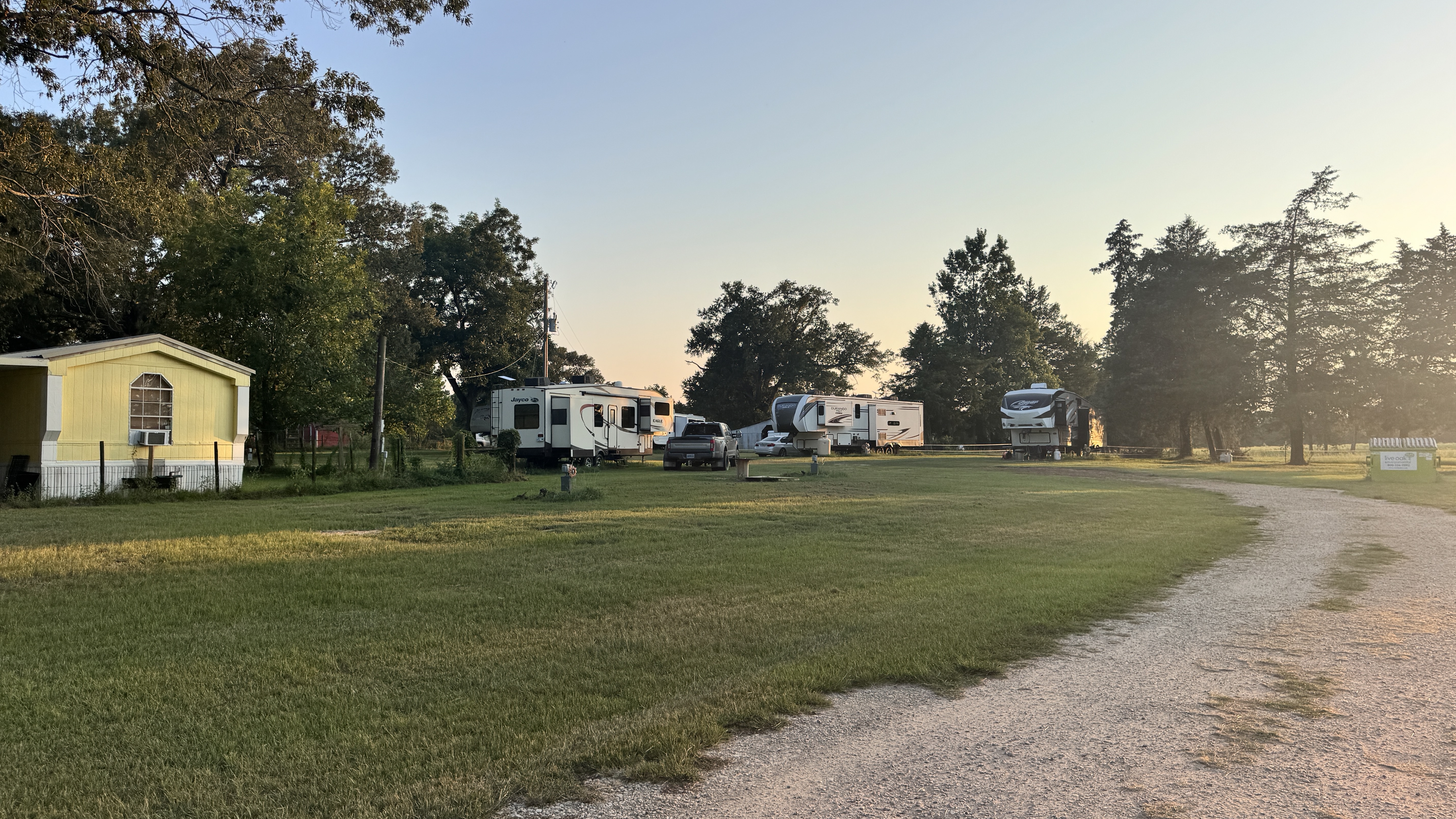 Entrance and road approach to Ancient Oak Resort RV park in Longview, Texas