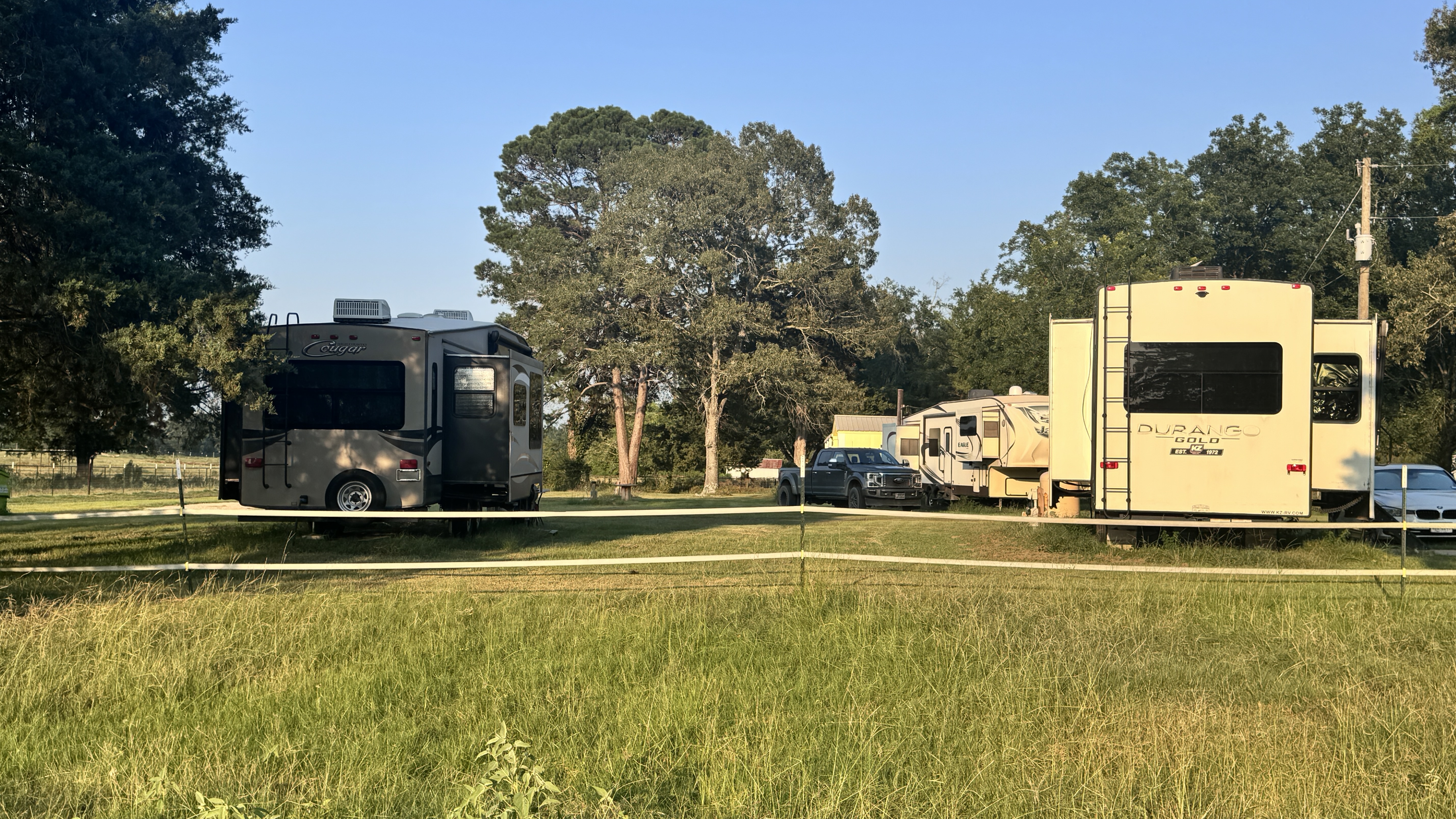 Wide spaced-out RV sites showing room between neighbors at Ancient Oak Resort Longview TX